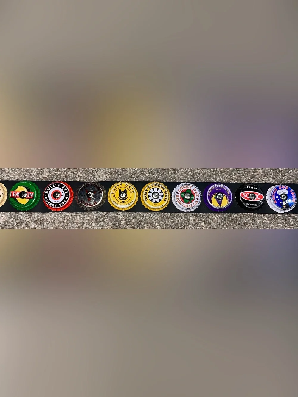 Little Earth seatbelt belt bottle caps
